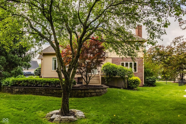 12539 Pebblepointe Pass, Carmel, IN 46033 - back of property featuring a chimney and brick siding