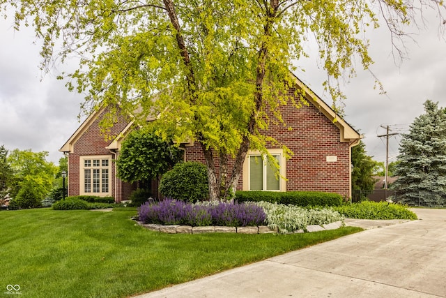 12539 Pebblepointe Pass, Carmel, IN 46033 - view of front facade featuring a front lawn and brick siding