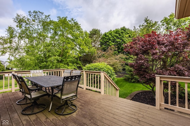12539 Pebblepointe Pass, Carmel, IN 46033 - deck with outdoor dining space, a lawn, and view of wooded area