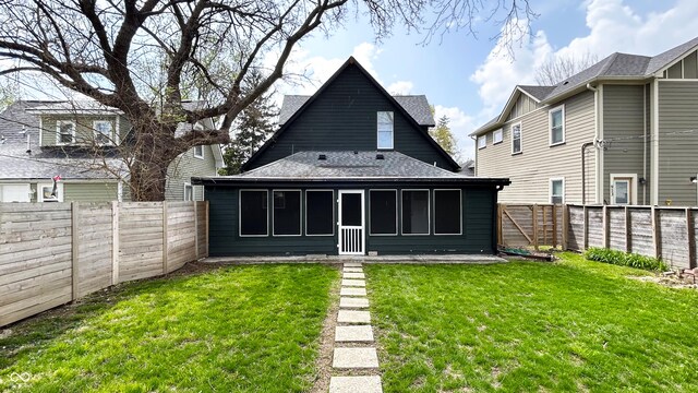 909 N Temple Ave, Indianapolis, IN 46201 - back of house with roof with shingles and a sunroom