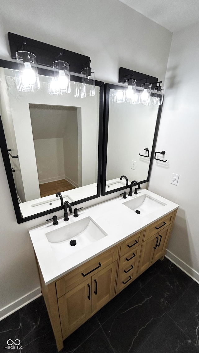 909 N Temple Ave, Indianapolis, IN 46201 - full bath with baseboards, double vanity, and marble finish floors