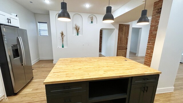 909 N Temple Ave, Indianapolis, IN 46201 - kitchen featuring stainless steel fridge, butcher block counters, light wood-style flooring, a center island, and recessed lighting