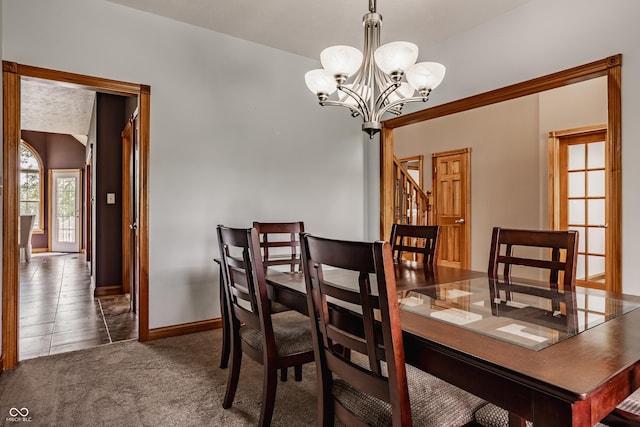 719 E New Rd, Greenfield, IN 46140 - dining room with a chandelier, carpet floors, and baseboards