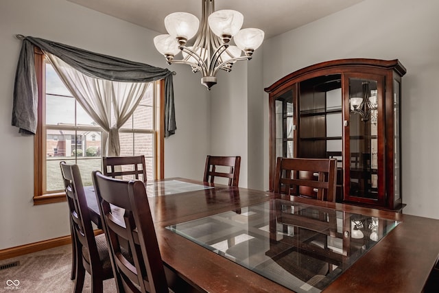 719 E New Rd, Greenfield, IN 46140 - dining space with a chandelier and carpet