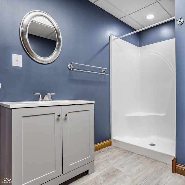 719 E New Rd, Greenfield, IN 46140 - bathroom with wood finished floors, a shower, vanity, and baseboards