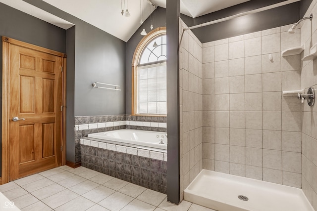 719 E New Rd, Greenfield, IN 46140 - bathroom featuring tile patterned flooring, tiled shower, a bath, and lofted ceiling