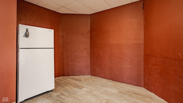 719 E New Rd, Greenfield, IN 46140 - unfurnished room with wood finished floors and a drop ceiling