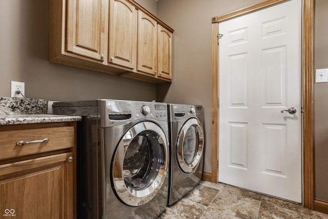 719 E New Rd, Greenfield, IN 46140 - laundry room featuring cabinet space, washer and dryer, and light stone finish flooring