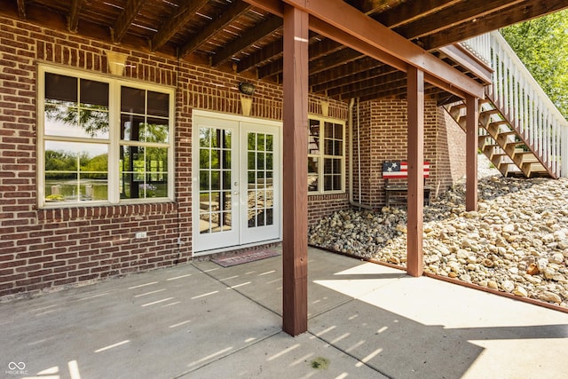 719 E New Rd, Greenfield, IN 46140 - view of patio featuring french doors, stairway, and a grill