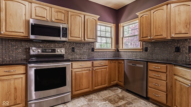 719 E New Rd, Greenfield, IN 46140 - kitchen with appliances with stainless steel finishes, dark countertops, and decorative backsplash