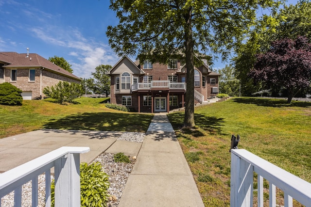 719 E New Rd, Greenfield, IN 46140 - back of property with french doors, brick siding, a wooden deck, and a yard