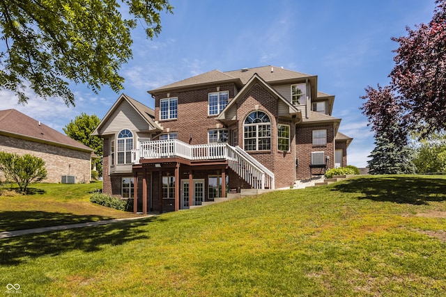 719 E New Rd, Greenfield, IN 46140 - rear view of property with brick siding, a deck, and a lawn