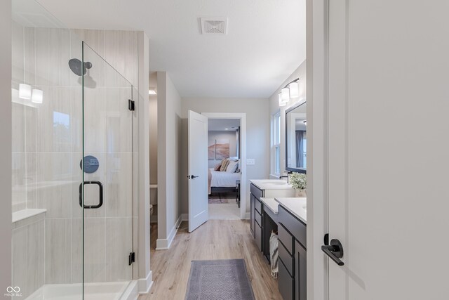 1085 Bevy Blvd, Danville, IN 46122 - ensuite bathroom with a shower stall, vanity, wood finished floors, toilet, and baseboards