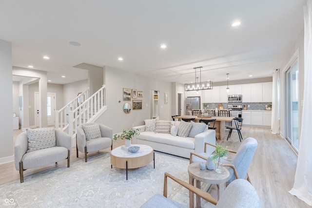 1085 Bevy Blvd, Danville, IN 46122 - living area with light wood finished floors, recessed lighting, and stairs