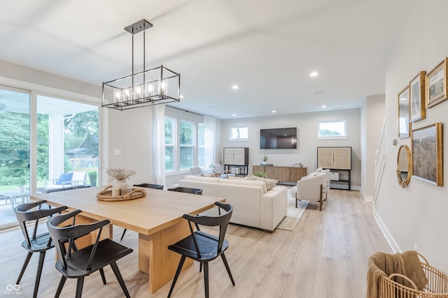 1085 Bevy Blvd, Danville, IN 46122 - dining space with healthy amount of natural light, light wood-style floors, baseboards, a chandelier, and recessed lighting