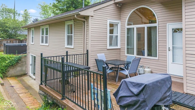 426 Tipton Ln, Columbus, IN 47201 - wooden deck featuring outdoor dining area and a hot tub
