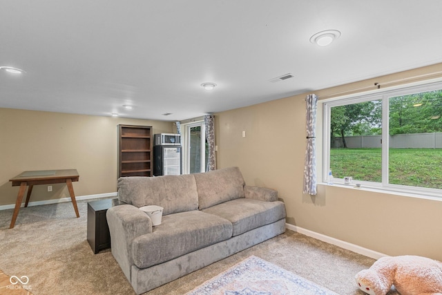 426 Tipton Ln, Columbus, IN 47201 - living area featuring light carpet and baseboards