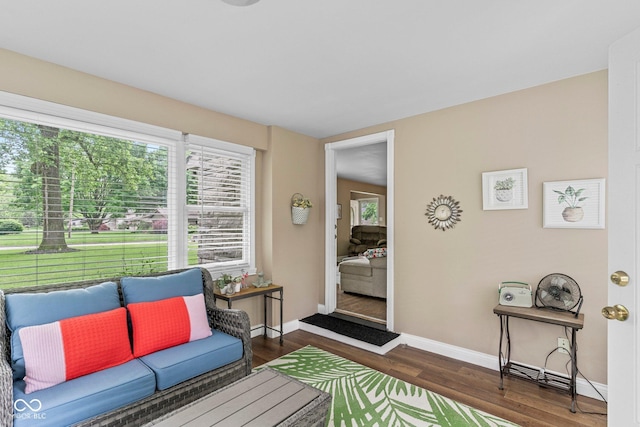 426 Tipton Ln, Columbus, IN 47201 - living area featuring baseboards and dark wood-style floors