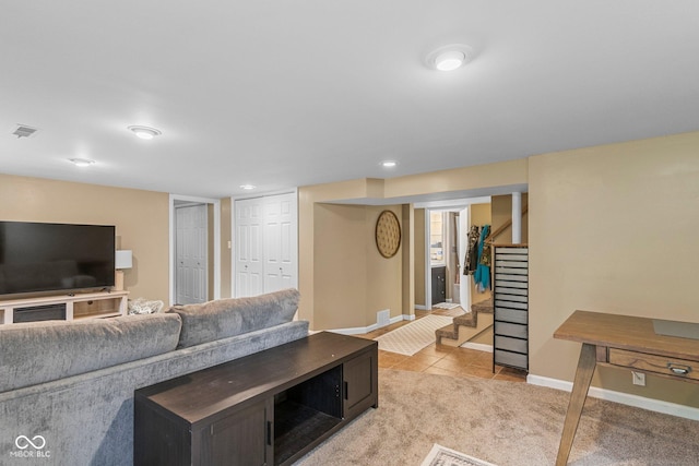426 Tipton Ln, Columbus, IN 47201 - living area featuring stairs, baseboards, and light tile patterned flooring