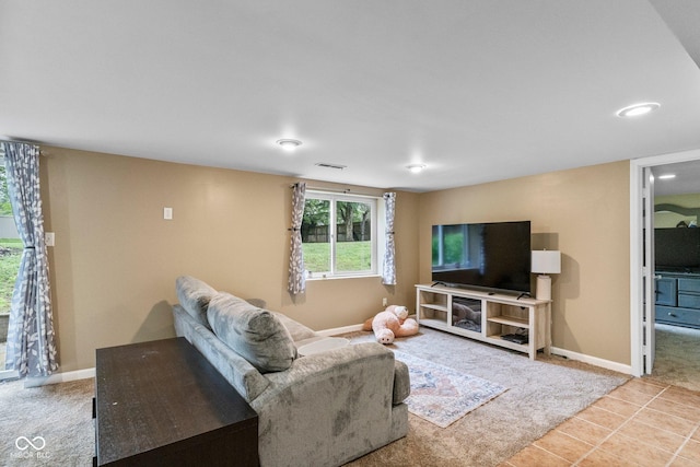 426 Tipton Ln, Columbus, IN 47201 - living area featuring baseboards and tile patterned flooring