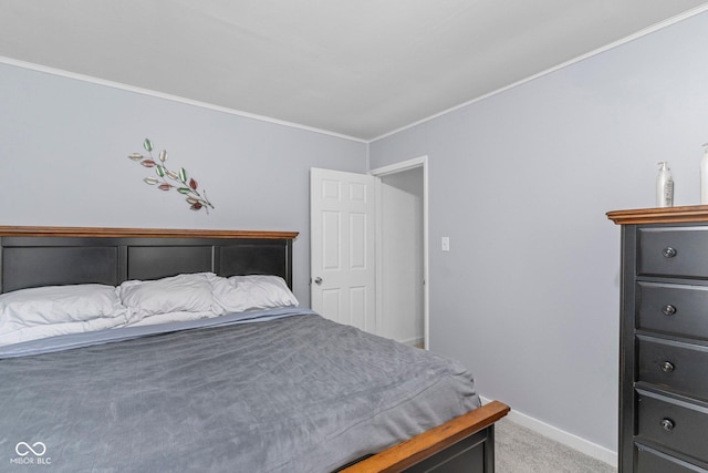 426 Tipton Ln, Columbus, IN 47201 - bedroom with crown molding, baseboards, and light colored carpet