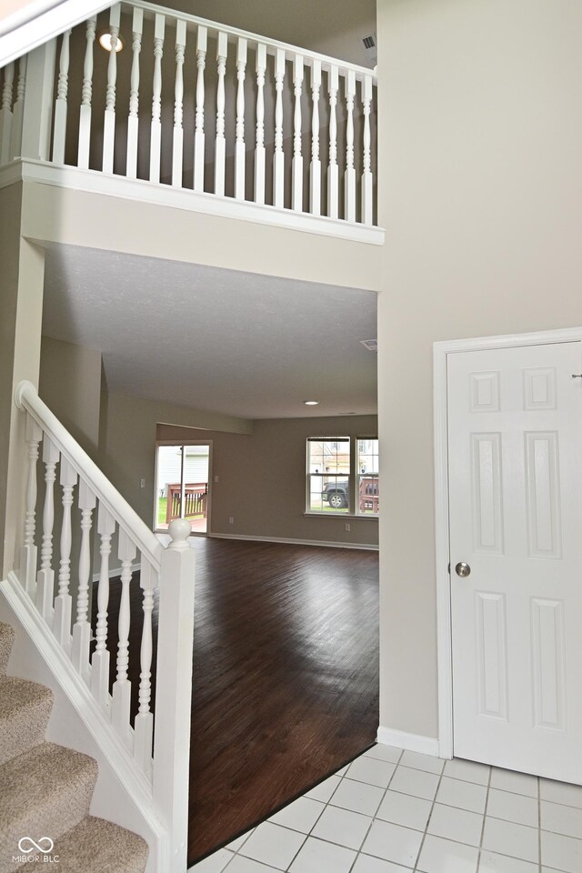 10722 Mistflower Way, Indianapolis, IN 46235 - stairs with tile patterned floors and baseboards