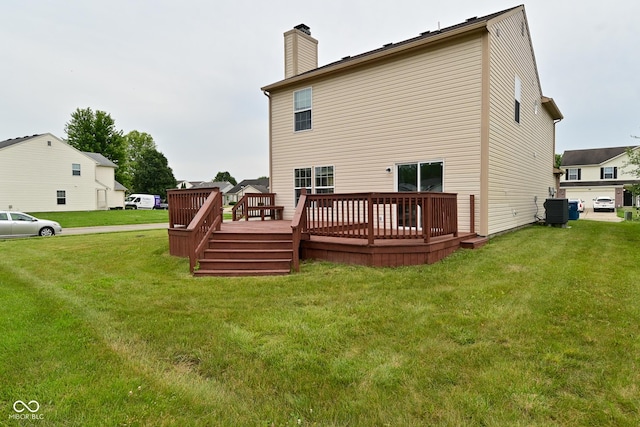 10722 Mistflower Way, Indianapolis, IN 46235 - back of property featuring a wooden deck, a chimney, and a yard