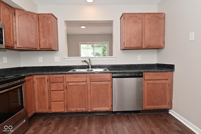 10722 Mistflower Way, Indianapolis, IN 46235 - kitchen with appliances with stainless steel finishes, dark wood-type flooring, recessed lighting, and brown cabinetry