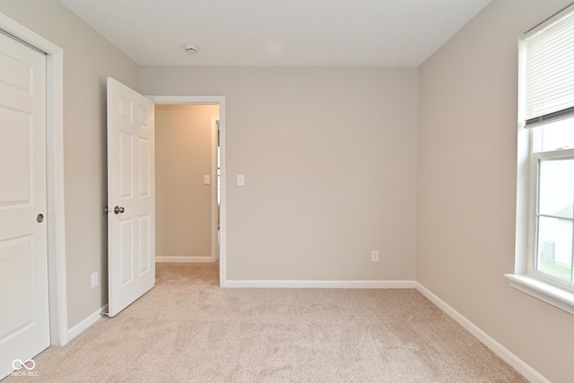 10722 Mistflower Way, Indianapolis, IN 46235 - unfurnished bedroom featuring light colored carpet
