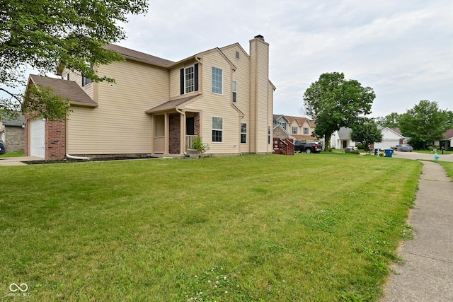 10722 Mistflower Way, Indianapolis, IN 46235 - traditional home with a chimney, a front yard, and a garage