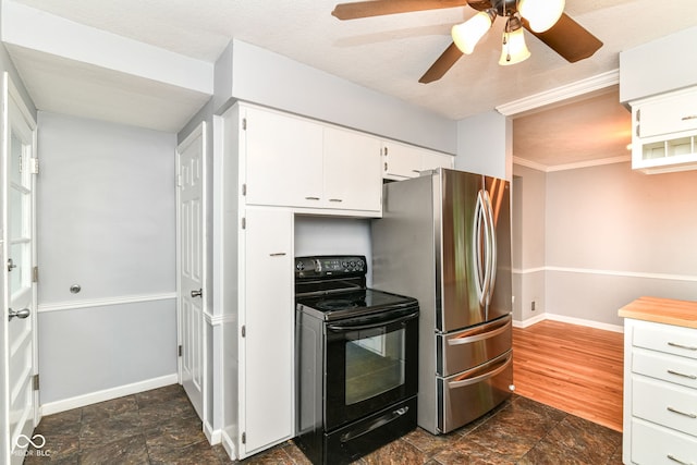 2526 Dell Zell Dr, Indianapolis, IN 46220 - kitchen with black electric range oven, freestanding refrigerator, baseboards, and dark stone finish flooring