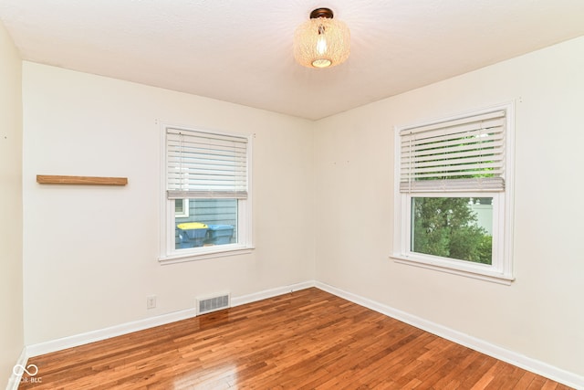 2526 Dell Zell Dr, Indianapolis, IN 46220 - unfurnished room featuring hardwood / wood-style flooring and baseboards