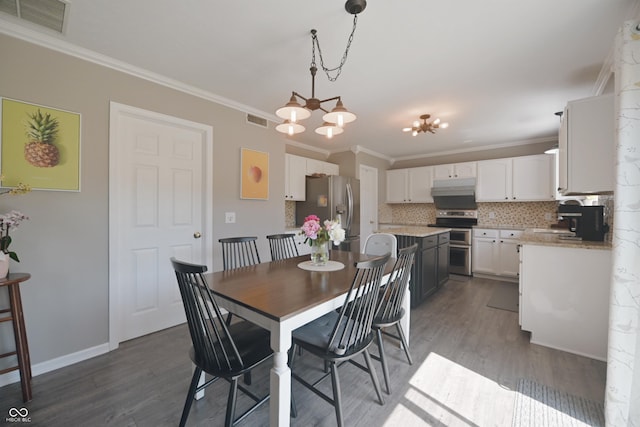 12677 Honors Dr, Carmel, IN 46033 - dining space featuring crown molding, dark wood-style flooring, a chandelier, and baseboards