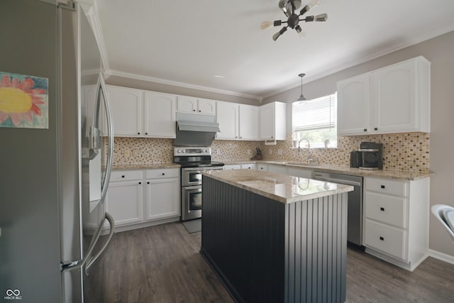 12677 Honors Dr, Carmel, IN 46033 - kitchen with appliances with stainless steel finishes, under cabinet range hood, a sink, crown molding, and dark wood-style floors