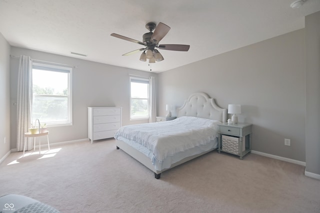 12677 Honors Dr, Carmel, IN 46033 - bedroom featuring light carpet, baseboards, and multiple windows