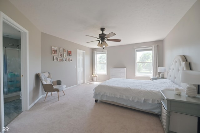 12677 Honors Dr, Carmel, IN 46033 - bedroom featuring light carpet, baseboards, ceiling fan, and ensuite bath