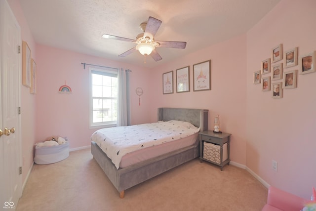 12677 Honors Dr, Carmel, IN 46033 - bedroom featuring light colored carpet, baseboards, and a ceiling fan