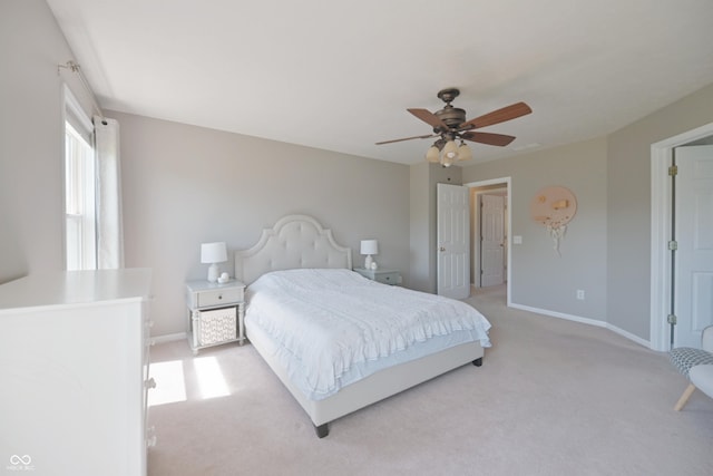 12677 Honors Dr, Carmel, IN 46033 - bedroom with light carpet, baseboards, and a ceiling fan
