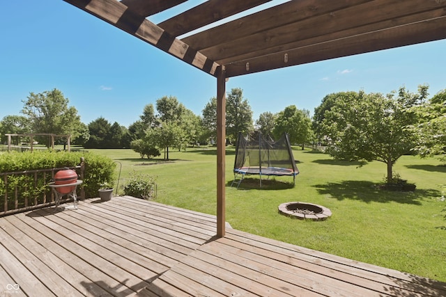 12677 Honors Dr, Carmel, IN 46033 - wooden deck with a yard, a trampoline, an outdoor fire pit, and a pergola