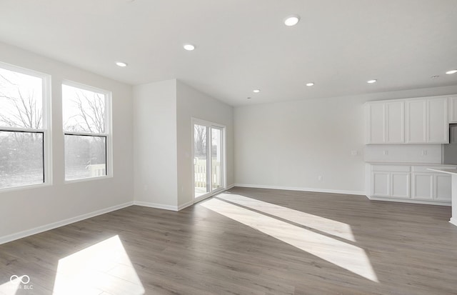 9741 Oleander Dr, Fishers, IN 46250 - unfurnished living room featuring light wood-style flooring, recessed lighting, and baseboards