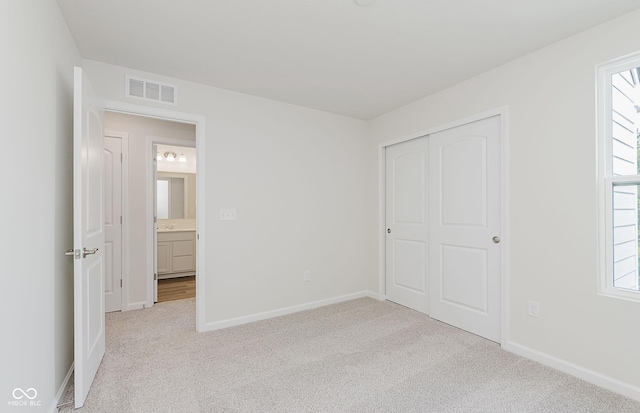 9741 Oleander Dr, Fishers, IN 46250 - unfurnished bedroom featuring light carpet and a closet