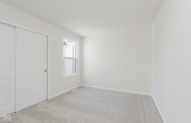 9741 Oleander Dr, Fishers, IN 46250 - unfurnished bedroom featuring light carpet and a closet