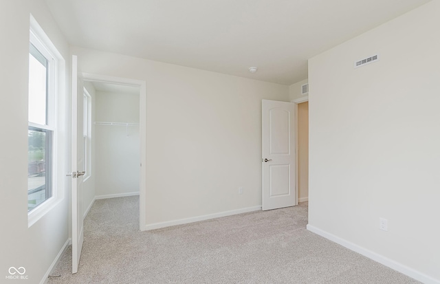9741 Oleander Dr, Fishers, IN 46250 - unfurnished room featuring healthy amount of natural light and light colored carpet