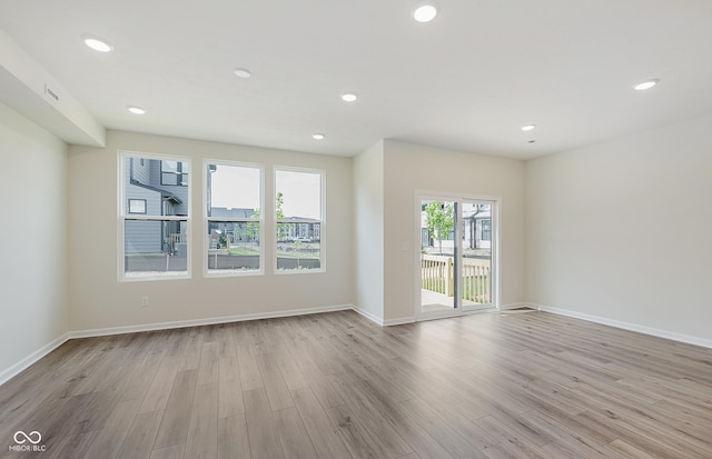 9741 Oleander Dr, Fishers, IN 46250 - empty room featuring light wood-style flooring and recessed lighting