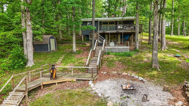8434 S Christian Dr, Nineveh, IN 46164 - rear view of house featuring stairs, a wooden deck, and metal roof
