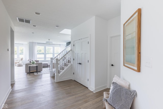 1088 Bevy Blvd, Danville, IN 46122 - hallway with light wood-style floors, baseboards, and stairway