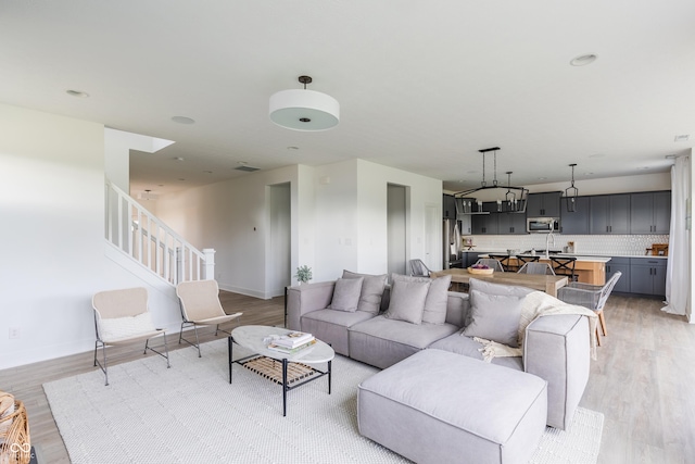 1088 Bevy Blvd, Danville, IN 46122 - living area with light wood-style floors and stairway