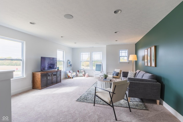 1088 Bevy Blvd, Danville, IN 46122 - carpeted living room with baseboards, healthy amount of natural light, a textured ceiling, and recessed lighting