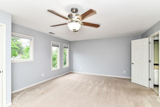 558 E Vermont St, Indianapolis, IN 46202 - unfurnished room featuring ceiling fan, carpet floors, and baseboards