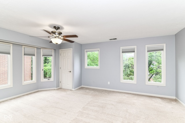 558 E Vermont St, Indianapolis, IN 46202 - unfurnished bedroom featuring carpet floors, baseboards, and ceiling fan